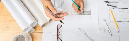 designer drawing with ruler